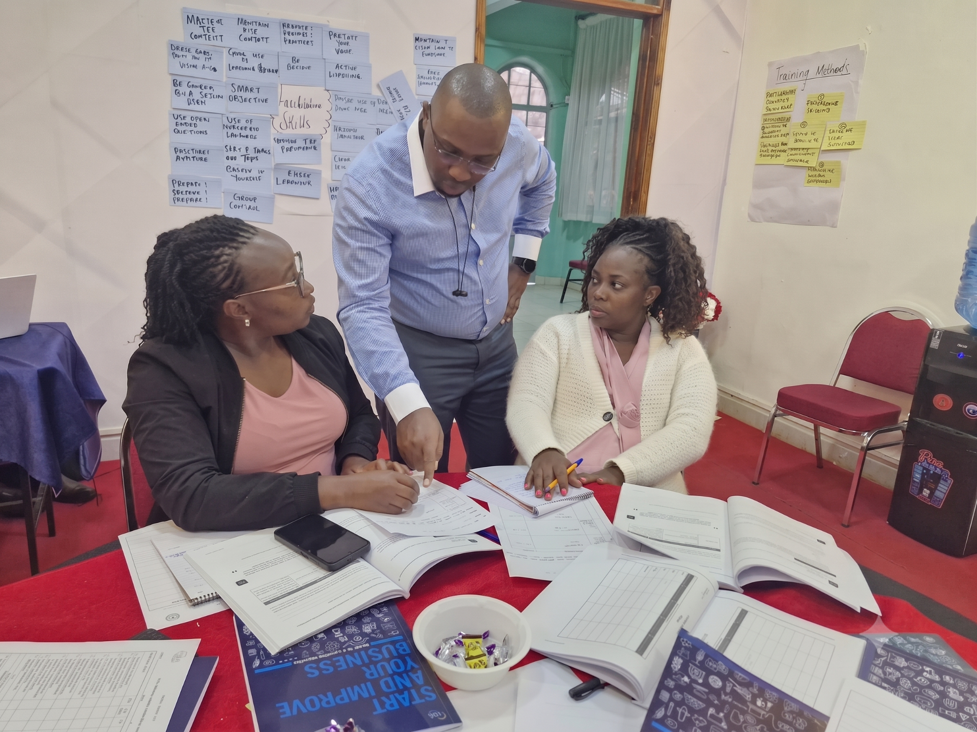 FINAC consultants reviewing financial strategy with a client team