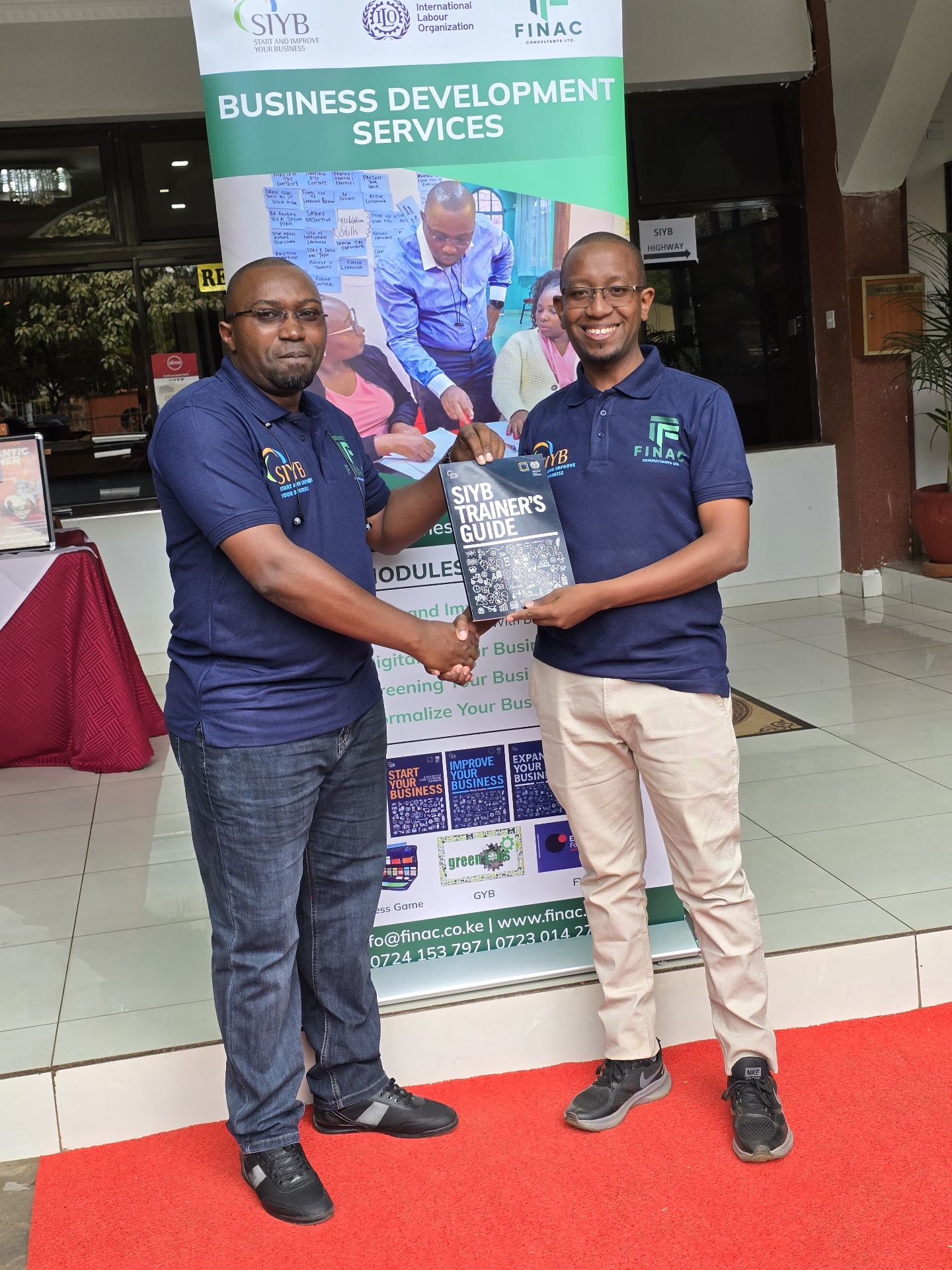FINAC trainer receiving an SIYB Trainer's Guide